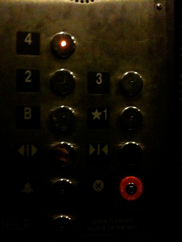 11:54 a.m.  In the elevator at school, headed up to my office to get some work done.