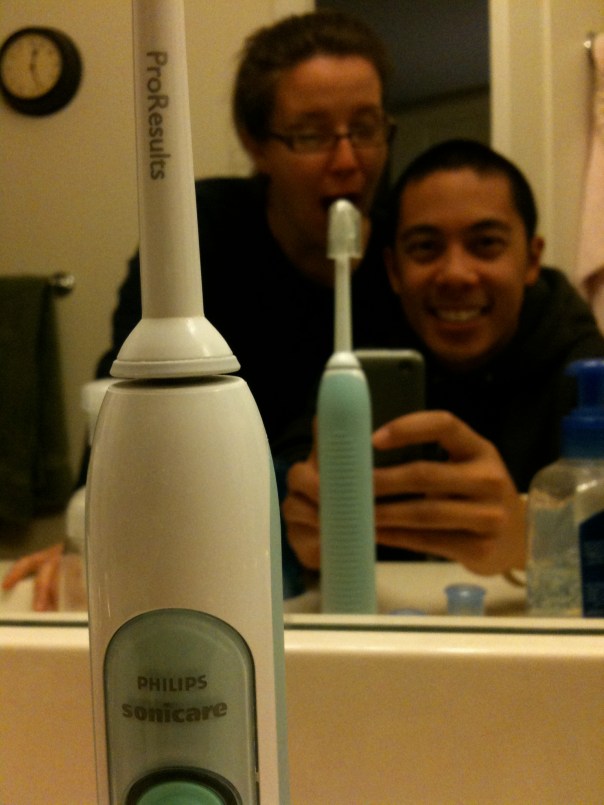 11:33 p.m.  Getting ready for bed, about to brush our teeth with the Sonicare.  Xan's being silly.